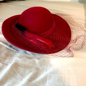Sylvia New York hat. Deep red with strap to go under chin. Perfect condition.
